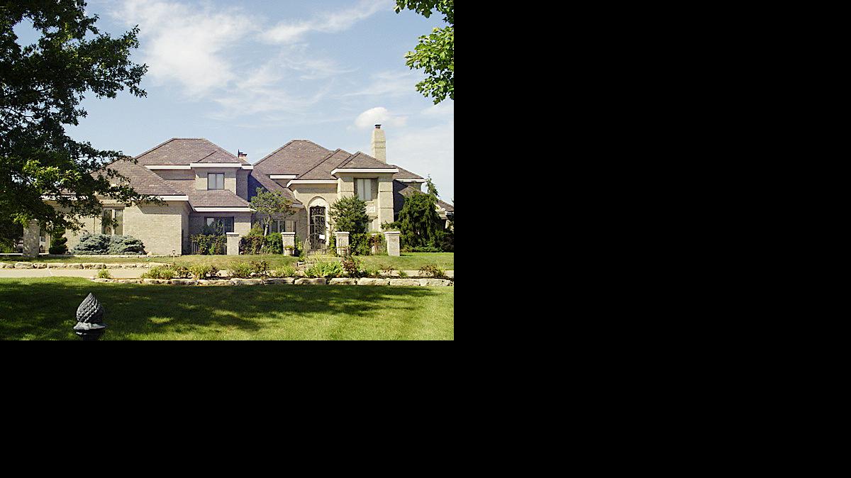 
This home, listed at $2,495,000, is fully clad in quality brick and features patios covered in ceramic tile. 

