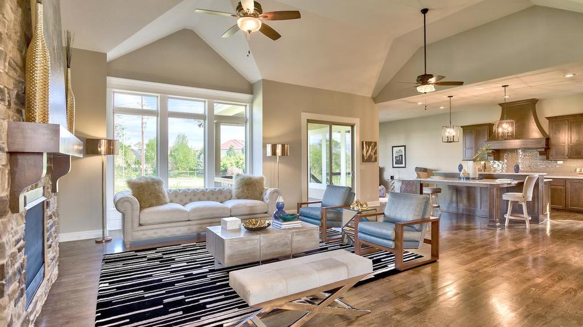 The spacious two-story, four-bedroom Anthem Reverse floor plan showcases functional layout with a centralized great room, gourmet kitchen and hearth room, perfect for a busy family and entertaining.
