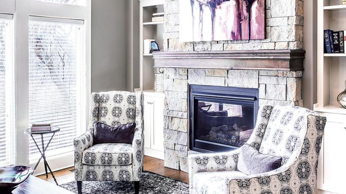 SAB Homes’ Augusta features a floor-to-ceiling stone fireplace, much like the one shown here.