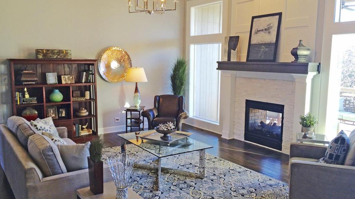 Soft grays dominate the decor of The Kensington reverse 1 1/2-story by Don Julian Builders at 13112 W. 170th St. It has a white kitchen, four-car garage and covered deck, and backs to a tree preserve. It is available now priced at $529,900.
