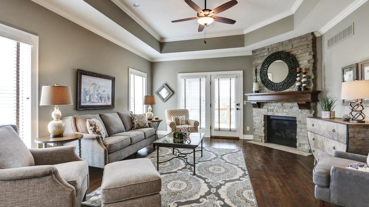An open floor plan and rich architectural details create an inviting living space at Covington Court Twin Villas.