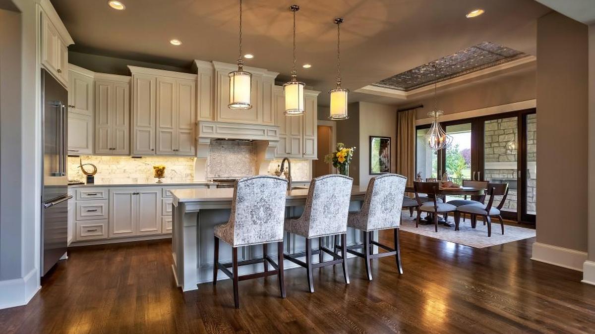 At just less than 5,000 square feet, the Raphael is a story-and-a-half estate home created in collaboration with award-winning Kansas City architect Scott Bickford and includes a large gourmet kitchen.