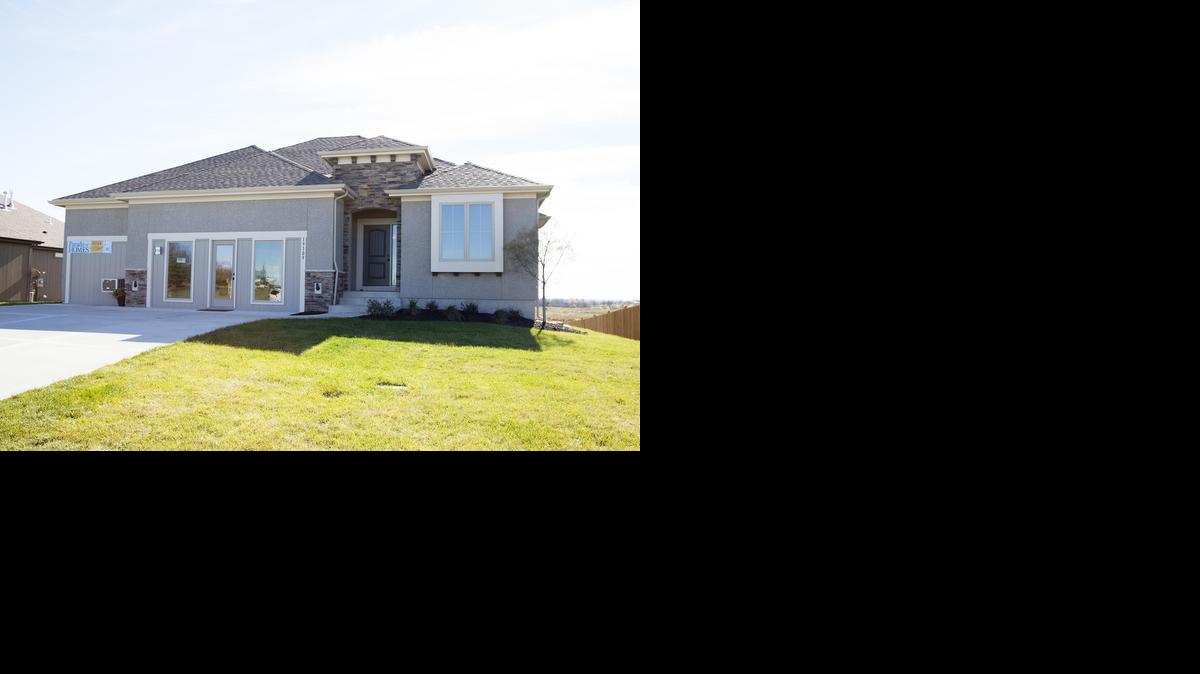 
Brookwood Farms’ new furnished model home is a four-bedroom, three-bathroom Marietta II reverse 1
1/2-story plan with a covered deck on a walkout lot. 
