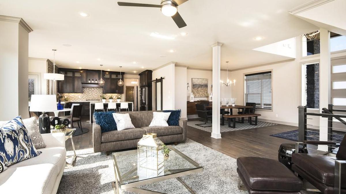 The St. Jude Dream Home Showplace features a contemporary front elevation with stucco, stone and natural wood elements.