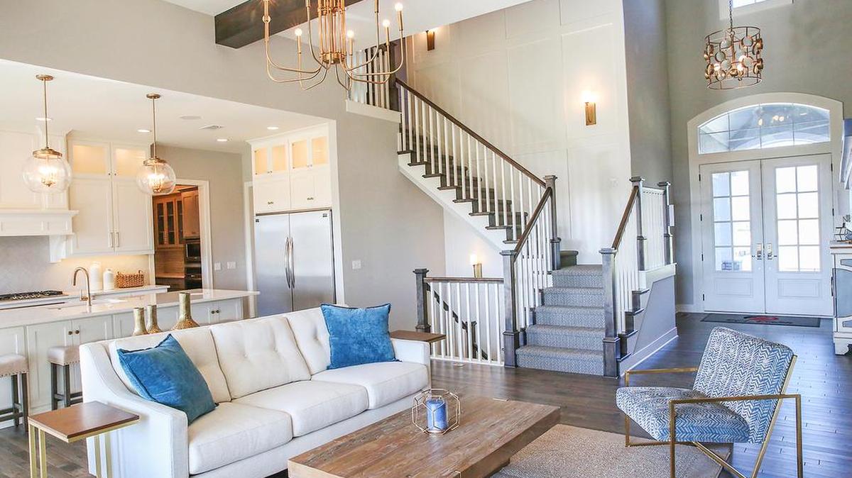 Ideally situated at 183rd and Caenen, Rodrock Development's Riverstone offers beautiful home sites with quiet country feel and city proximity. And there are a number of fabulous move-in ready abodes, including the outstanding 1.5-story Windermere Reverse by BCI-Bowen Custom Homes, which won 1st place in Distinctive Plan & Design at the Parade of Homes. An impressive two-story entry opens up to a beamed Great Room with stone fireplace and gleaming hardwoods.