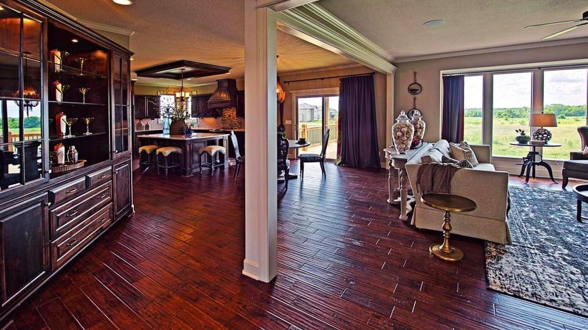 An open floor plan and rich architectural details create an inviting living space in the Makenna plan.