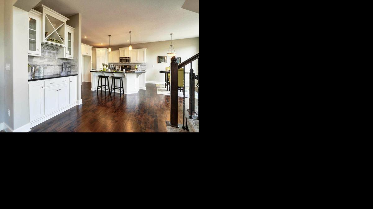 
The all-white kitchen and bulter’s pantry in Woodland Ridge’s model home are top trends for 2015.
