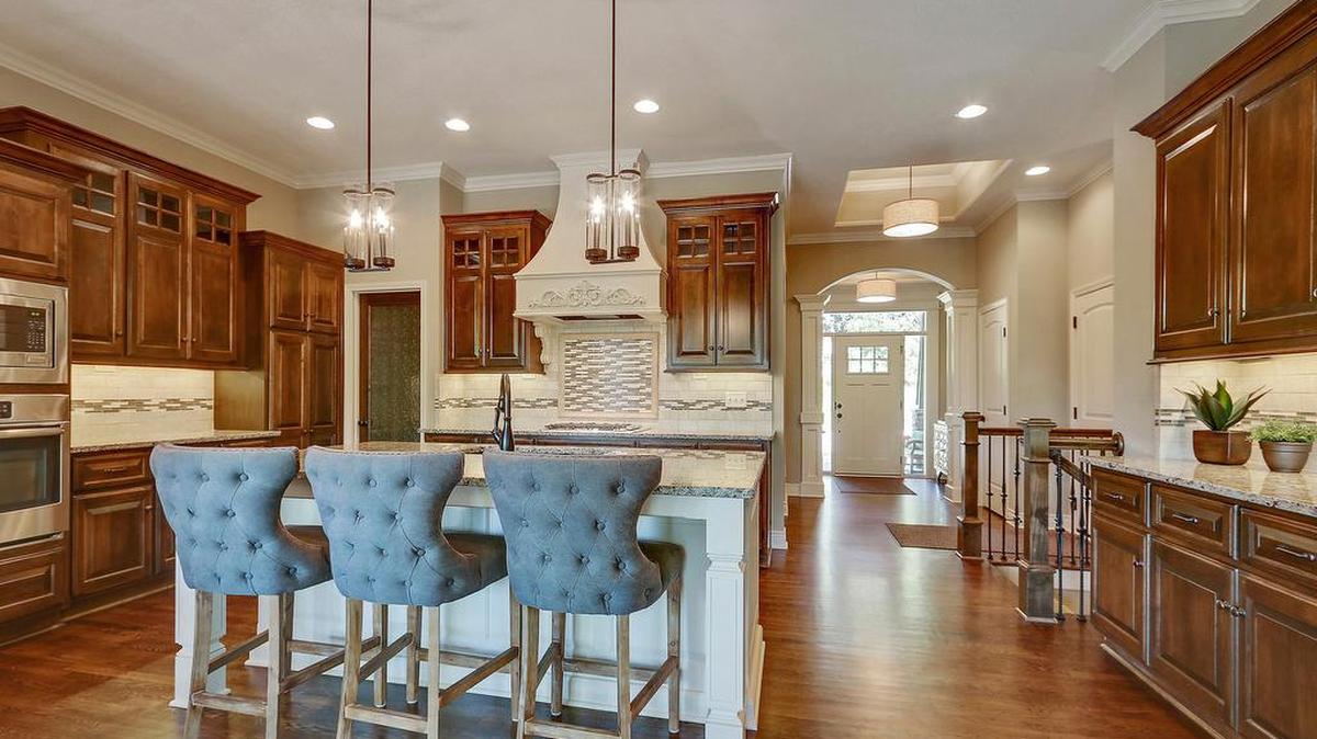 Custom cabinetry, granite countertops and hardwood floors are among the luxurious kitchen finishes offered at Gatewood Villas.