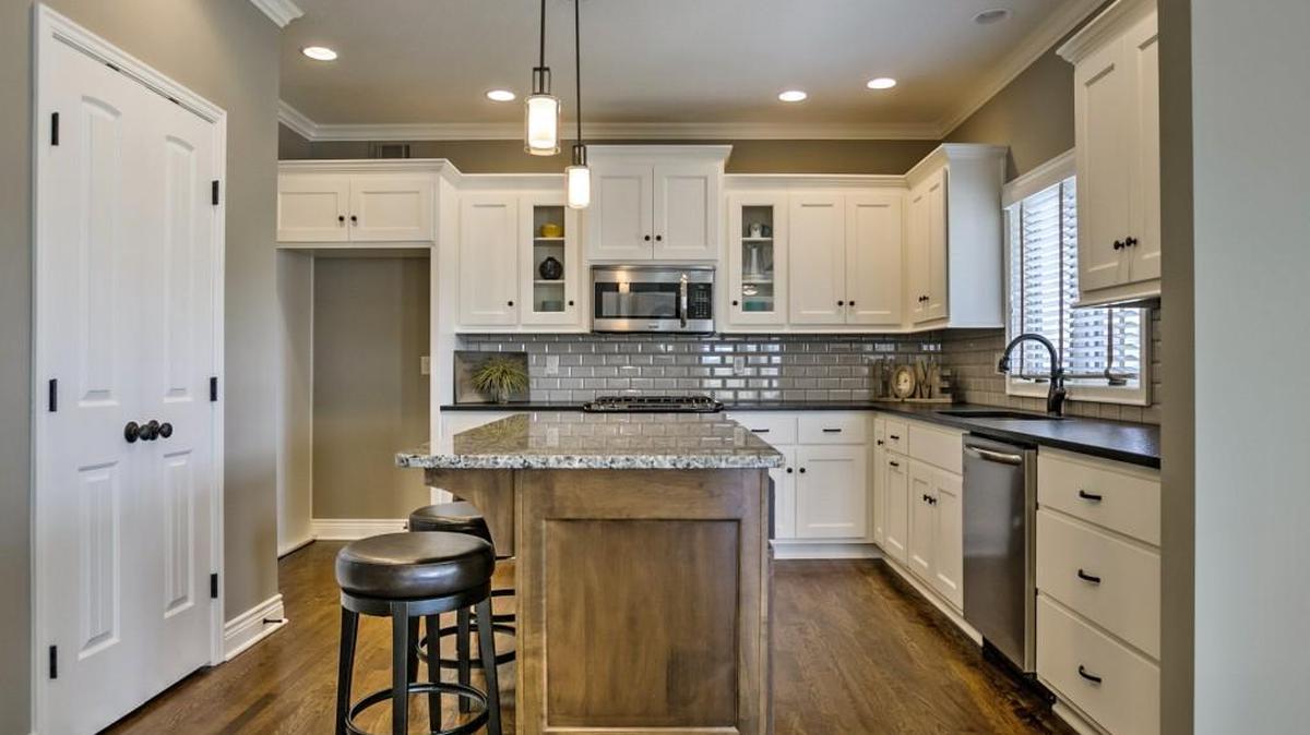 Custom cabinetry, granite countertops and hardwood floors are among the luxurious kitchen finishes offered at Covington Court.