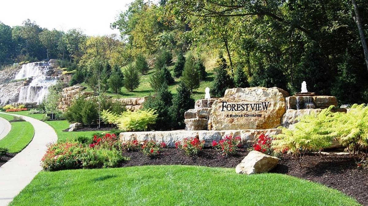 Past a cascading 50-foot waterfall, atop natural rock bluffs and amid lush greenery, Forest View sits nestled above the fray, giving residents a feeling of seclusion — yet it remains just minutes from city life.