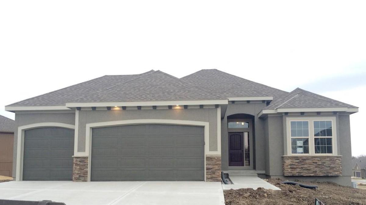 The Madalena reverse 1½-story by Comerio Corporation is located at 16901 Haskins St. and features four bedrooms, a covered deck, a finished walkout basement and 30-day delivery, priced at $399,950.