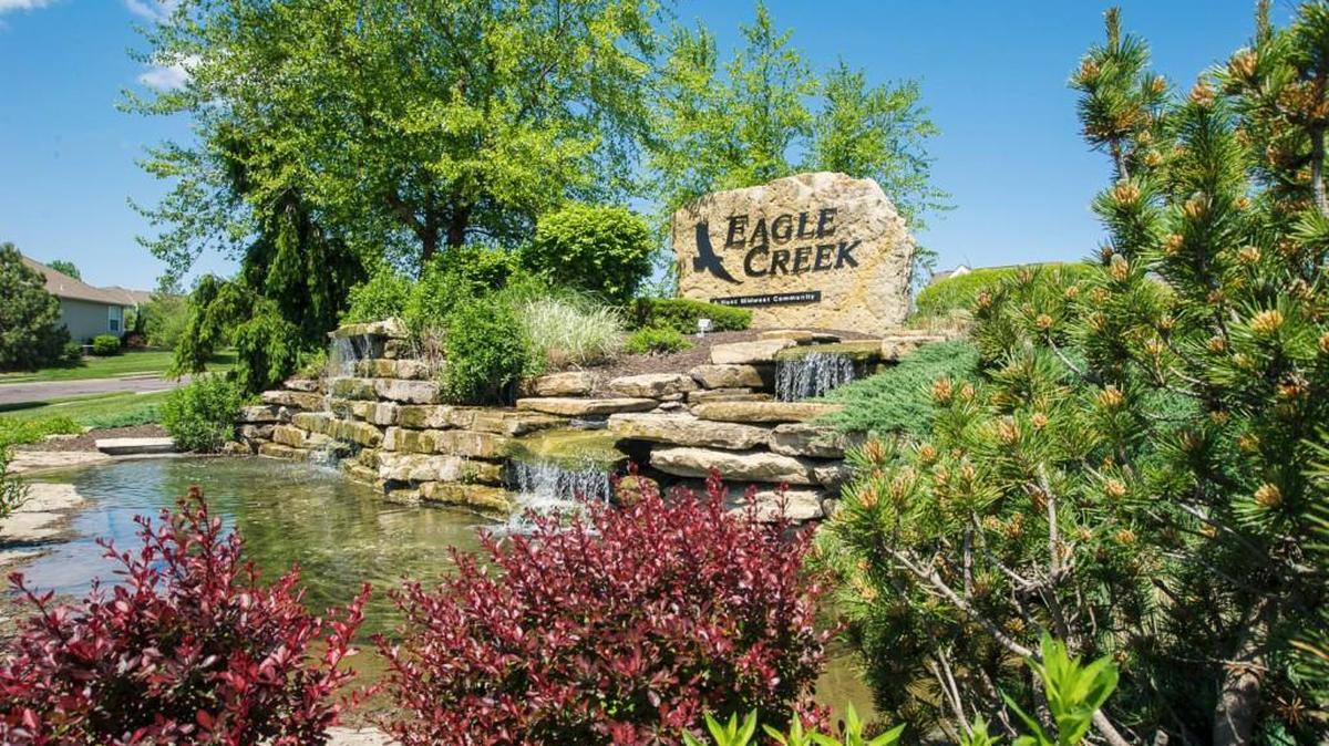 Visitors to Eagle Creek in Lee’s Summit are greeted by monuments with cascading waterfalls and generous landscaping.