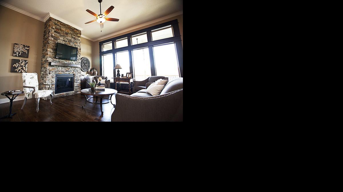 
On the main floor of the spacious reverse 1
1/2-story home at 12810 W. 49th Terrace in HeatherGlen are the master bedroom, guest bedroom, separate office, two full baths, great room, dining room, covered porch area and open-concept kitchen.
