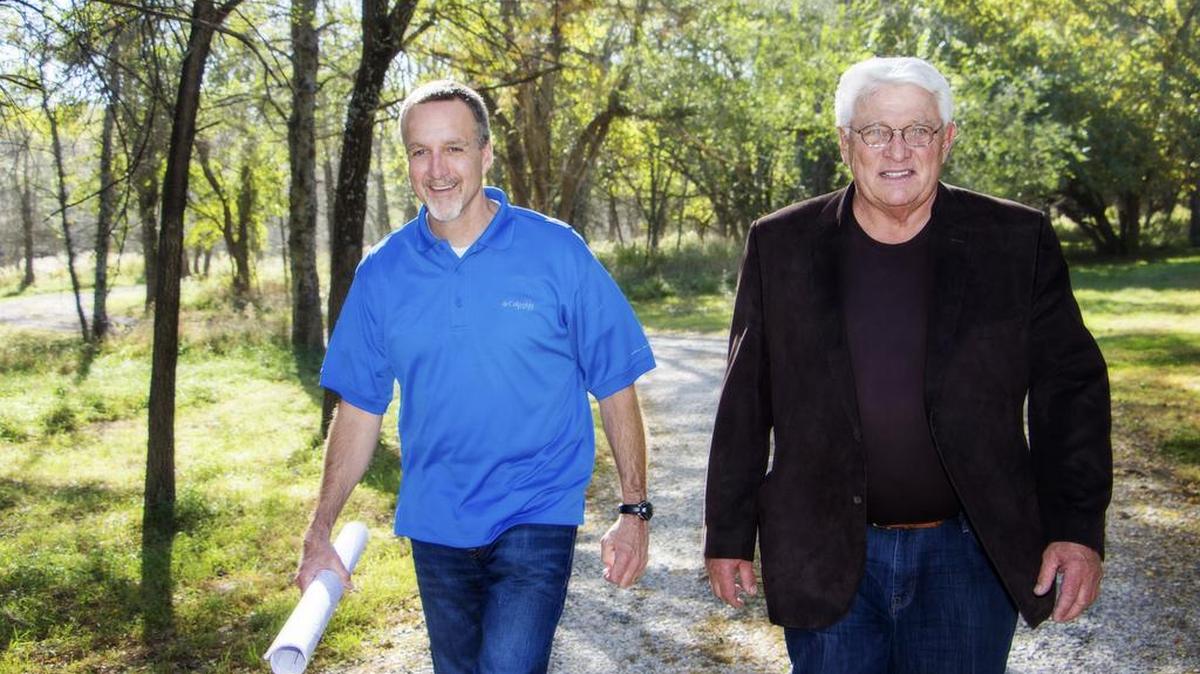 Darol Rodrock, along with Rodrock Development’s General Manager Tom Langhofer, walk the grounds of one of Darol’s 80-plus communities in Johnson County. For some 35 years, Rodrock Developments has built quiet communities, laden with amenities, in which families grow and flourish.