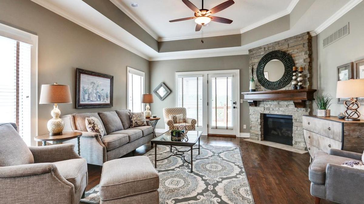 An open floor plan and rich architectural details create an inviting living space at Covington Court Twin Villas.