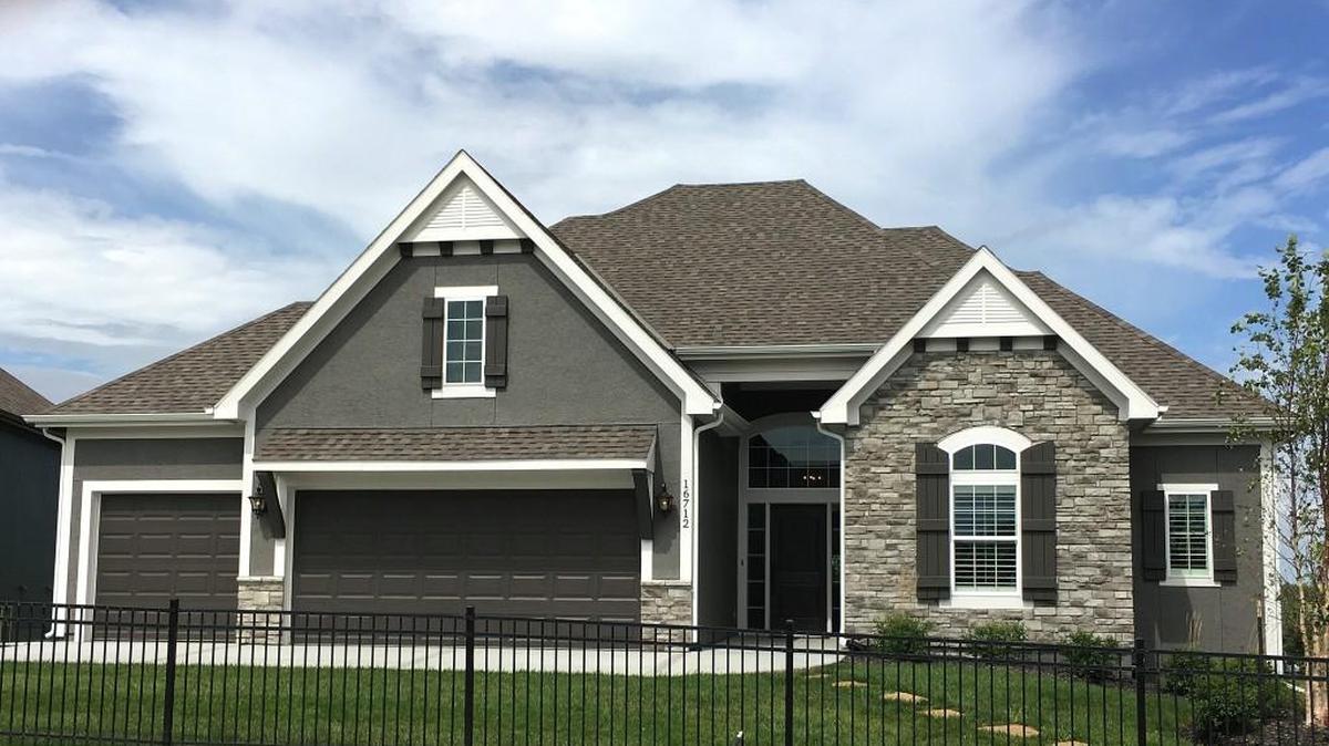 James Engle Custom Homes presents their newest reverse 1½-story plan, The Jameson, located at 16712 Haskins. The home features a spa-like master bathroom with free-standing tub; a covered deck; a walkout/up finished basement with walk-behind bar; high ceilings and a first-floor study. The home has a base price at $329,000 plus lot.