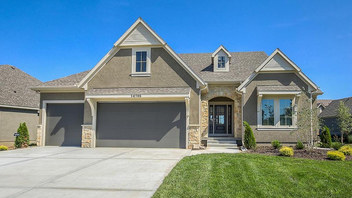 The Villas of Leabrooke Town Manor includes the highly desired Norwood, a spacious floor plan that includes a three-car garage. This spec home is located at 14705 Meadow Lane and includes many upgrades that will surely delight the buyer.