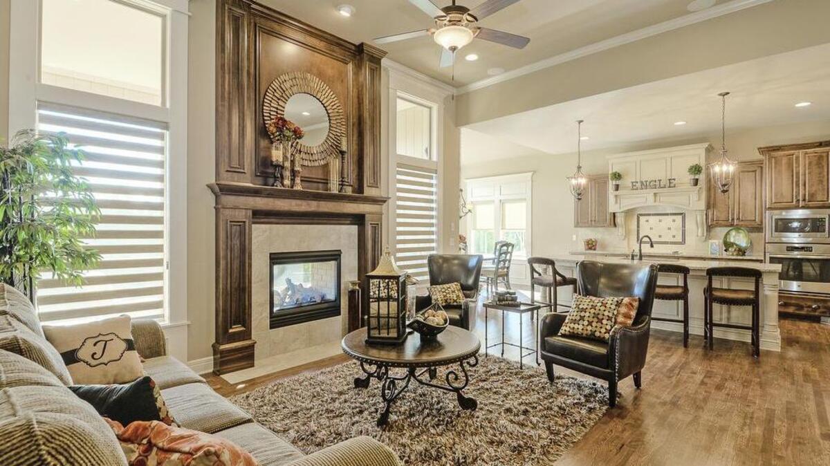Located off of 68th Street in Shawnee, Rodrock Development’s Greens of Chapel Creek has the Emery Reverse by James Engle Custom Homes at the ready. Beautifully appointed, this abode has a waterfall granite island, custom cabinetry, gorgeous hardwood floors, and a covered deck on a walkout cul-de-sac lot. With a bar, rec room, and 2 bedrooms and a bathroom in the basement, this home offers fabulous style for just $506,125.