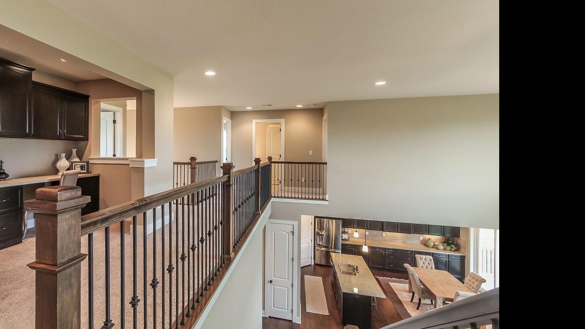 
Inspired Homes offers extra touches and creative use of space, such as this loft area with a computer desk that makes a perfect study area for kids.
