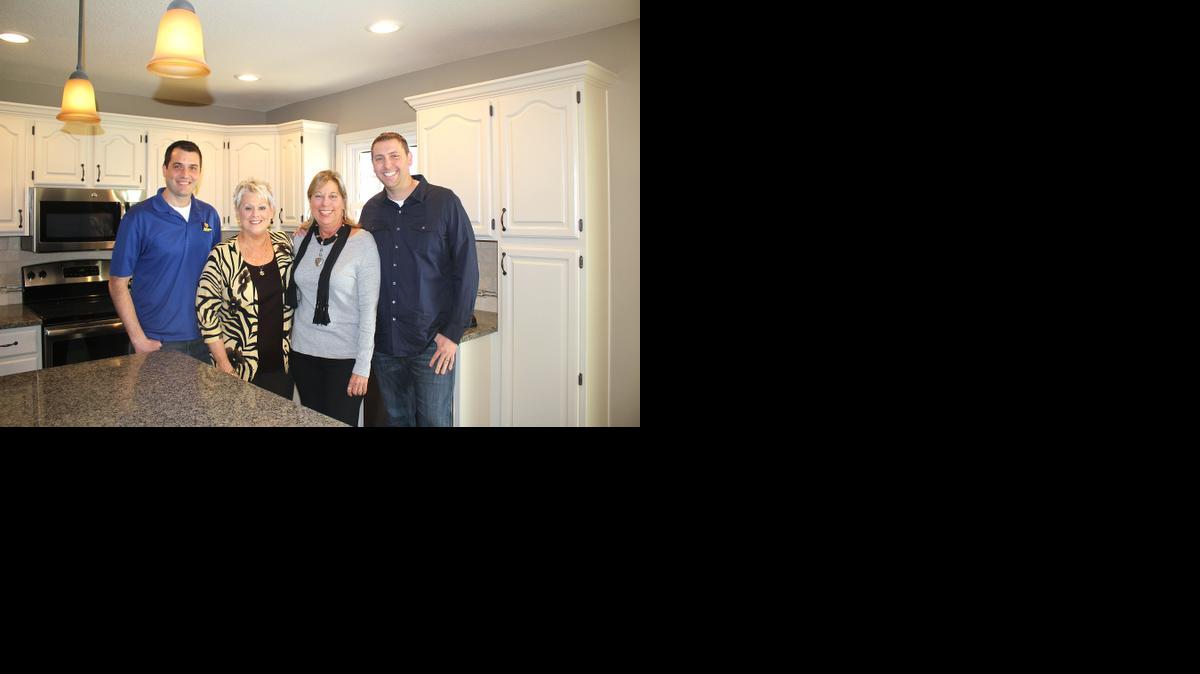 
Sisters Cheryl Pierce, second from left, and Mary Arbuckle are pleased with how KCCashHomebuyers handled the purchase and renovation of their mother’s home. With them are KCCashHomebuyers owners Brett Shelton, left, and Brandon Logan.
