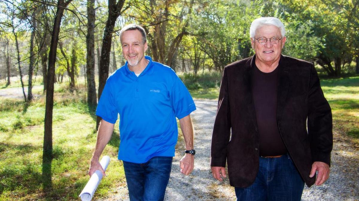 Rodrock Development’s general manager, Tom Langhofer, left, and owner, Darol Rodrock, tour the company’s newest development, Sundance Ridge at 175th and Kenneth Road.