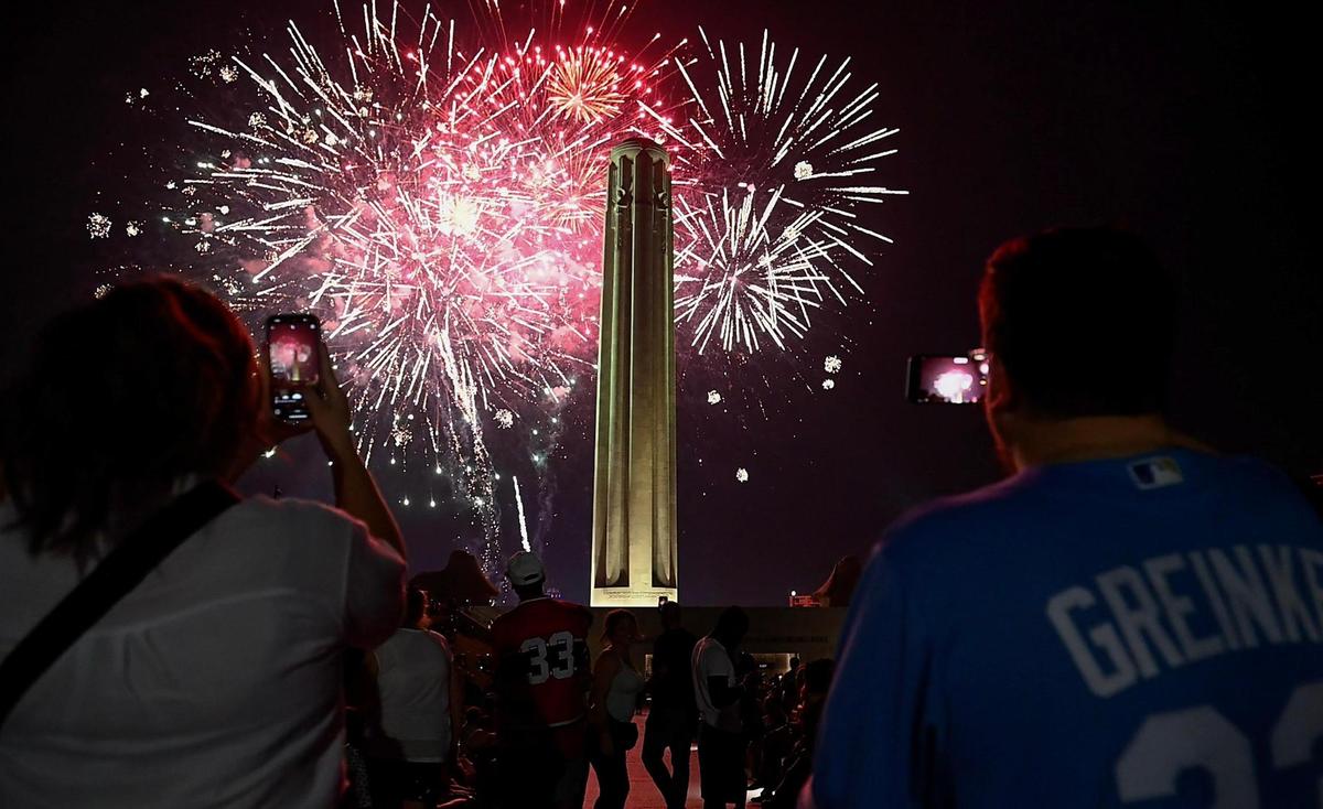 Fireworks illuminate the sky during the Stars and Stripes Picnic at the National WWI Museum and Memorial on Tuesday, July 4, 2023, in Kansas City.