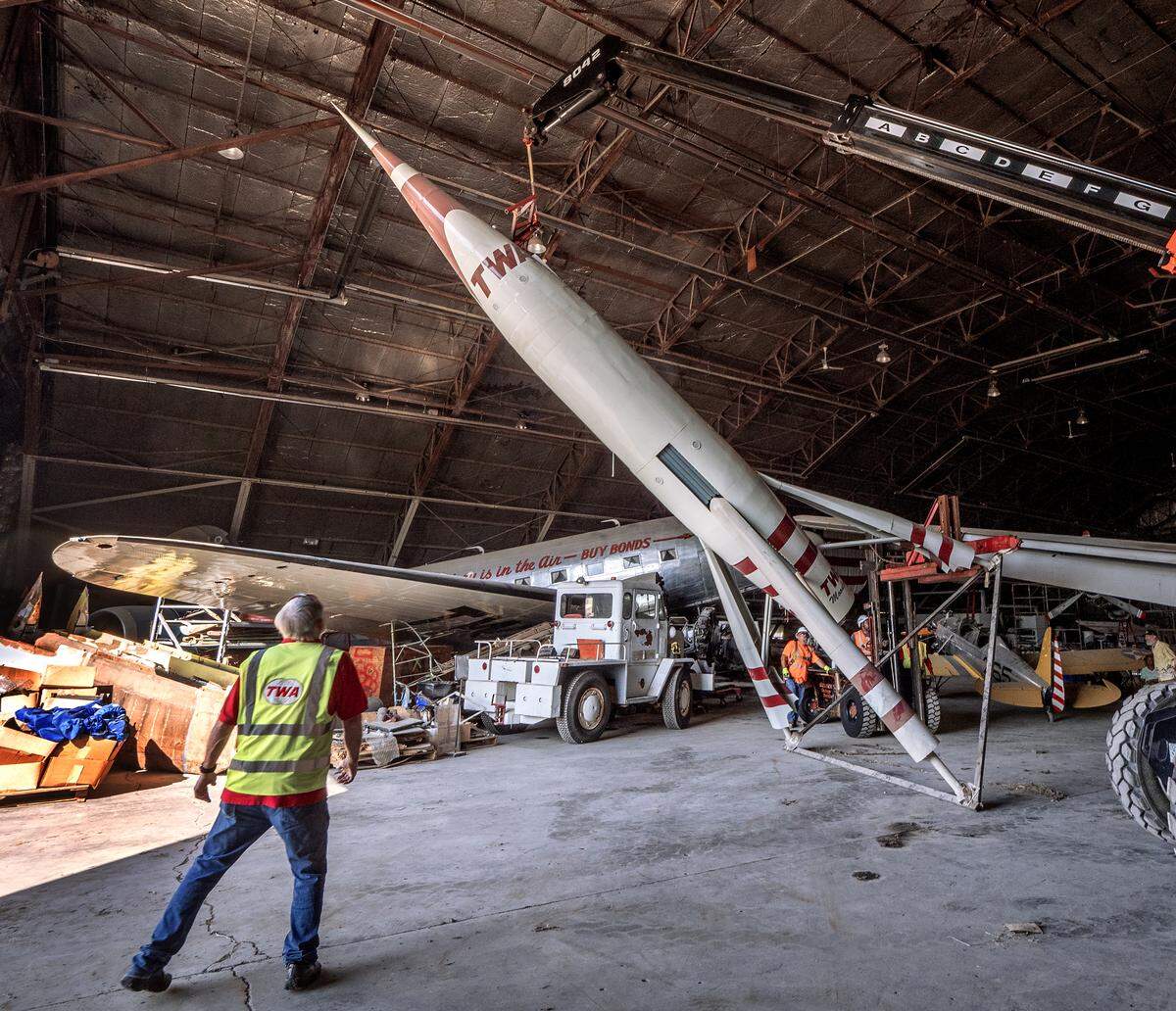 A Belger Cartage tips the TWA Moonliner II rocket on its side to prepare it for its move on Saturday.
