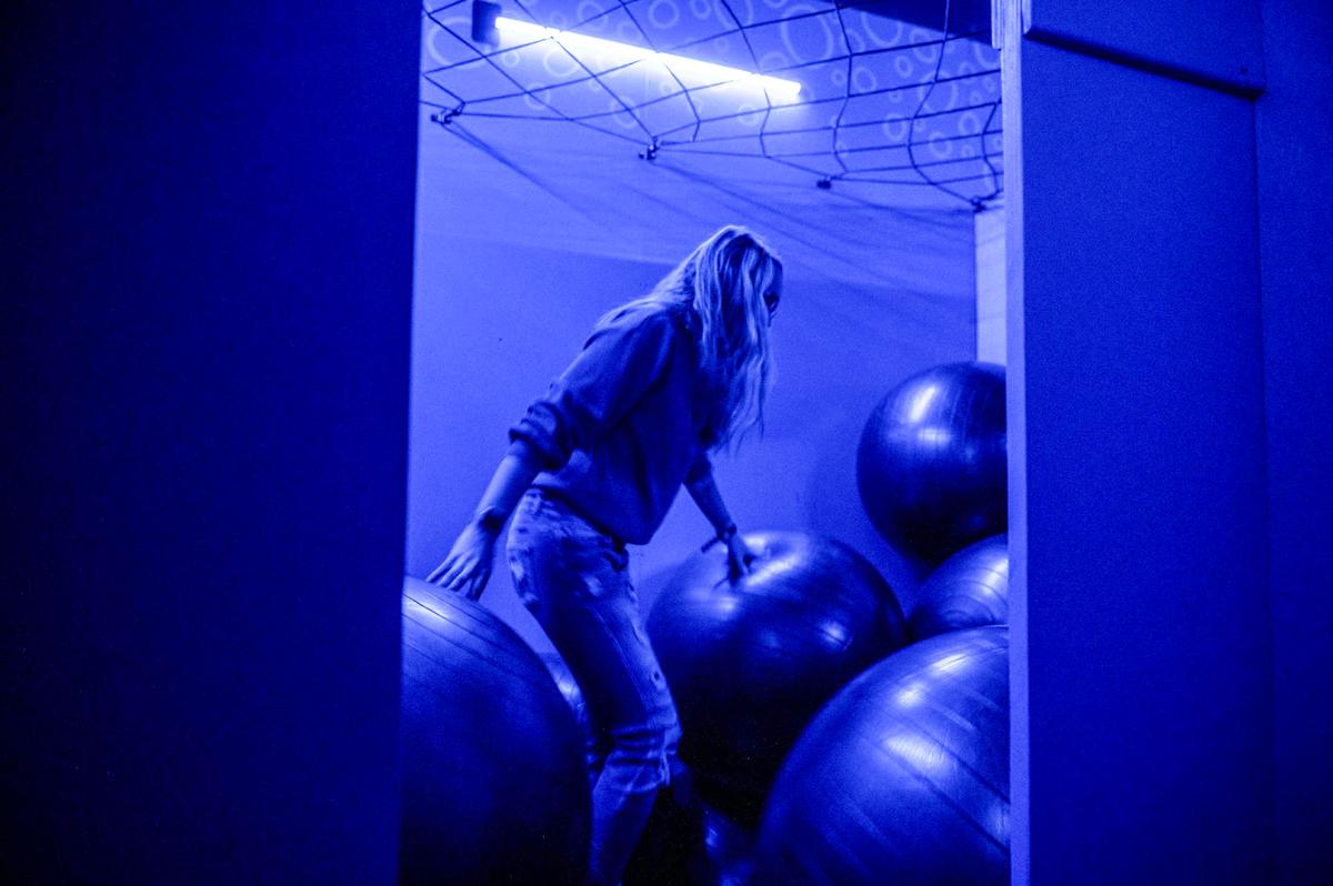In the game Squeeze, players must fight their way through a room of yoga balls.