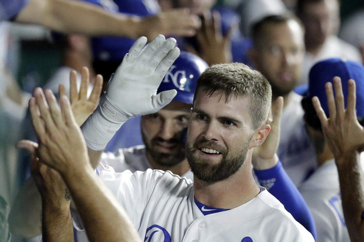 Kansas City Royals’ Bubba Starling celebrates in the dugout after scoring on a throwing error by Atlanta Braves catcher Brian McCann after he hit a three-run double during the third inning of a baseball game Tuesday, Sept. 24, 2019, in Kansas City, Mo. (AP Photo/Charlie Riedel)