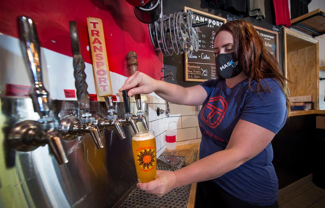 Christie Merandino, operations manager at Transport Brewery in downtown Shawnee, urges Johnson County voters to repeal a law requiring businesses that sell alcohol to make 30% of their money from food. 