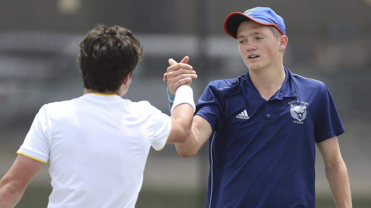 Olathe West's Brett Seaton, right, defeated two-time defending champion Rodney Steven of Bishop Carroll to claim the class 5A singles tennis title on Saturday in Emporia. 