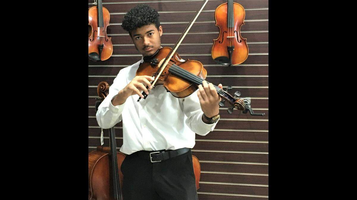 Emery Edwards, plays the viola at his school and in the Olathe Youth Symphony. Thanks to Band of Angels, Emery now has his own viola to play.