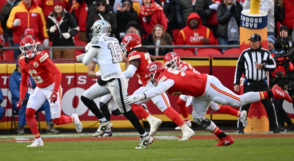 Kansas City Chiefs defensive tackle Chris Jones (95) dives for Las Vegas Raiders quarterback Aidan O’Connell (12) in the second quarter on Friday, Nov. 29, 2024, at GEHA Field at Arrowhead Stadium.