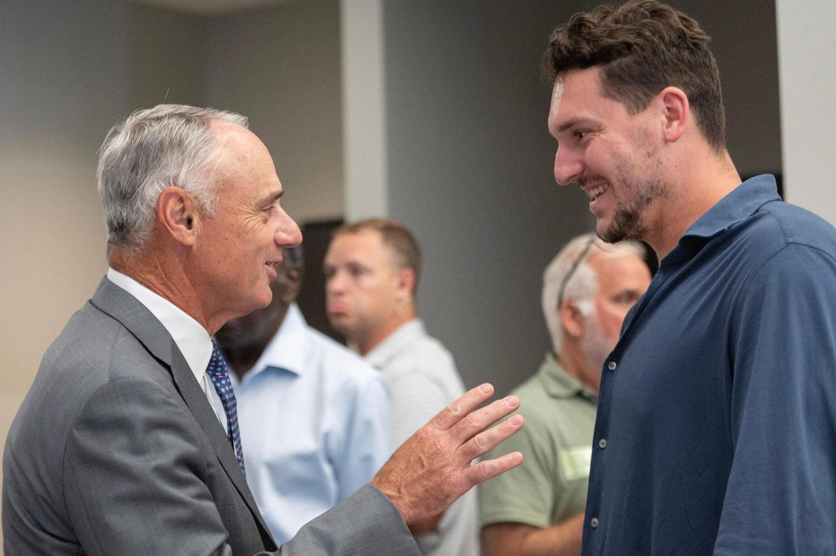 Rob Manfred, MLB commissioner, left, speaks to Kansas City Royals first baseman Vinnie Pasquantino while attending “The State of The Game” press conference at the Urban Youth Academy on Wednesday, Aug. 16, 2023, in Kansas City.
