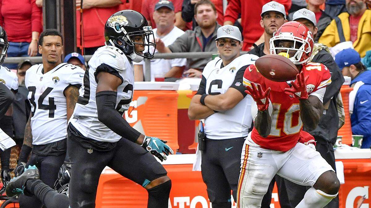 Chiefs wide receiver Tyreek Hill, right, pulled in a pass for a 36-yard gain against Jaguars cornerback Jalen Ramsey in the third quarter Sunday in KC.