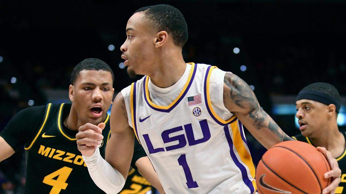 LSU guard Xavier Pinson drives the ball around Missouri guard Javon Pickett (left) during the game Saturday, Feb. 26, 2022 in Baton Rouge, La. (Hillary Scheinuk/The Advocate via AP)