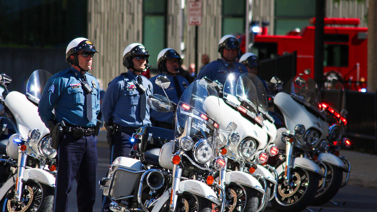 A Kansas City police motorcycle unit stands at attention at an annual ceremony honoring fallen officers on May 9, 2024. A motorcycle officer was involved in a shooting in Kansas City on Thursday.