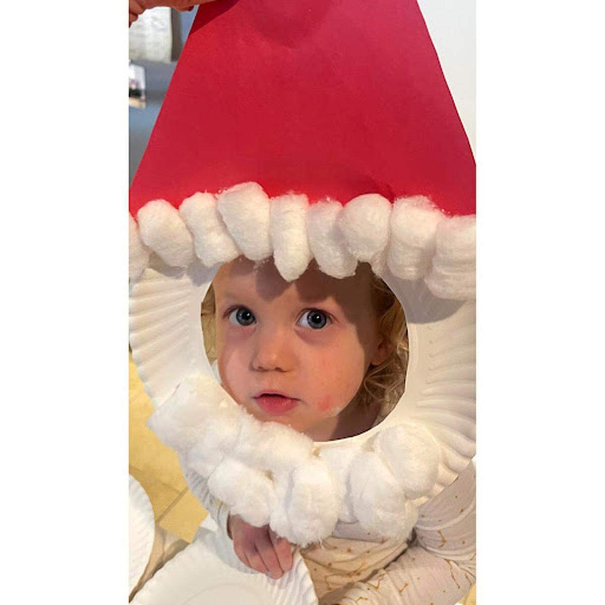 In December, Us Weekly published this Brittany Mahomes photo of a “festive craft”: daughter Sterling wearing a Santa Claus mask.