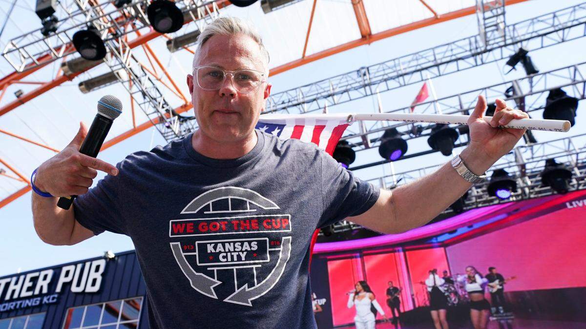Kansas City radio personality Nate Bukaty wears a shirt commemorating winning a World Cup bid during a watch party for the announcement of the FIFA World Cup 2026 host cities at Power & Light District on June 16, 2022.