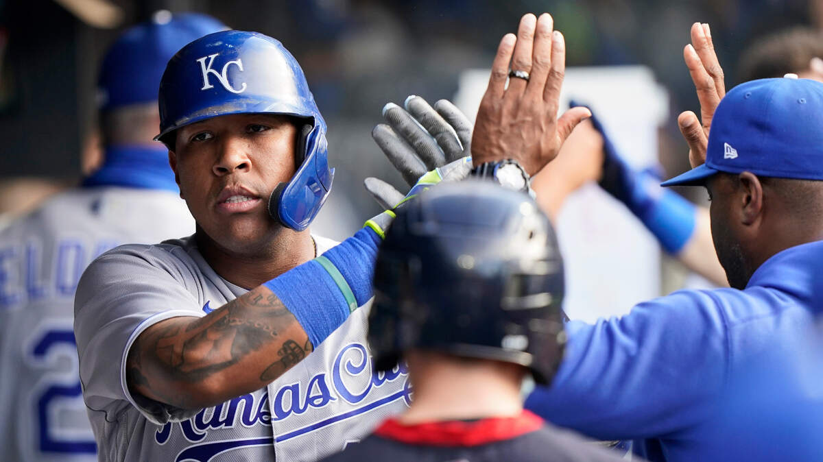 Kansas City Royals’ Salvador Perez celebrates with teammates after hitting a two-run home run in the fourth inning of a baseball game against the Cleveland Indians, Saturday, July 10, 2021, in Cleveland. (AP Photo/Tony Dejak)