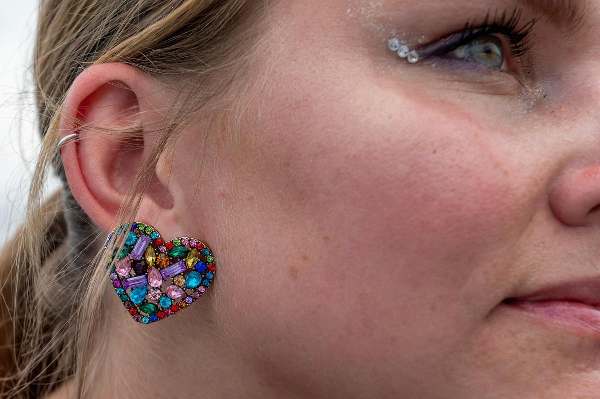 Sarah Smith sports “Bejeweled” styled earrings at Taylor Swift’s Eras Tour stop at GEHA Field at Arrowhead Stadium on Friday, July 7, 2023, in Kansas City.