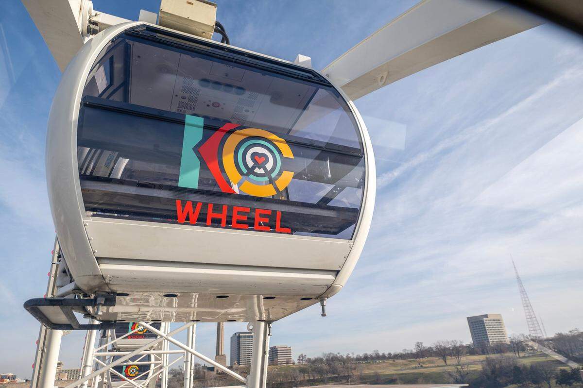 The gondolas on the KC Wheel gently rock to stay level as riders are carried through the air on the observation wheel.