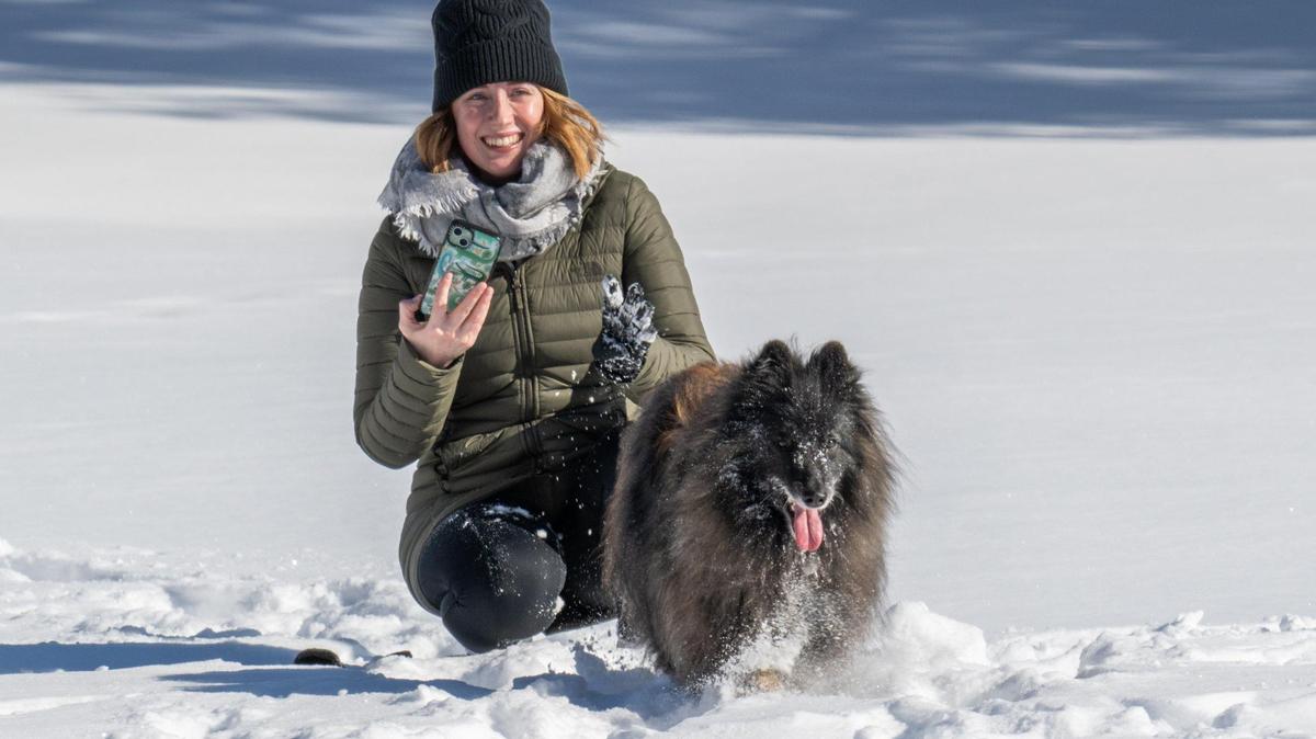 Alexandra Purvis-Smith and her dog, Zelda, play in the snow in Kansas City on Monday. Could more snow be on the way? Here’s what the National Weather Service says.