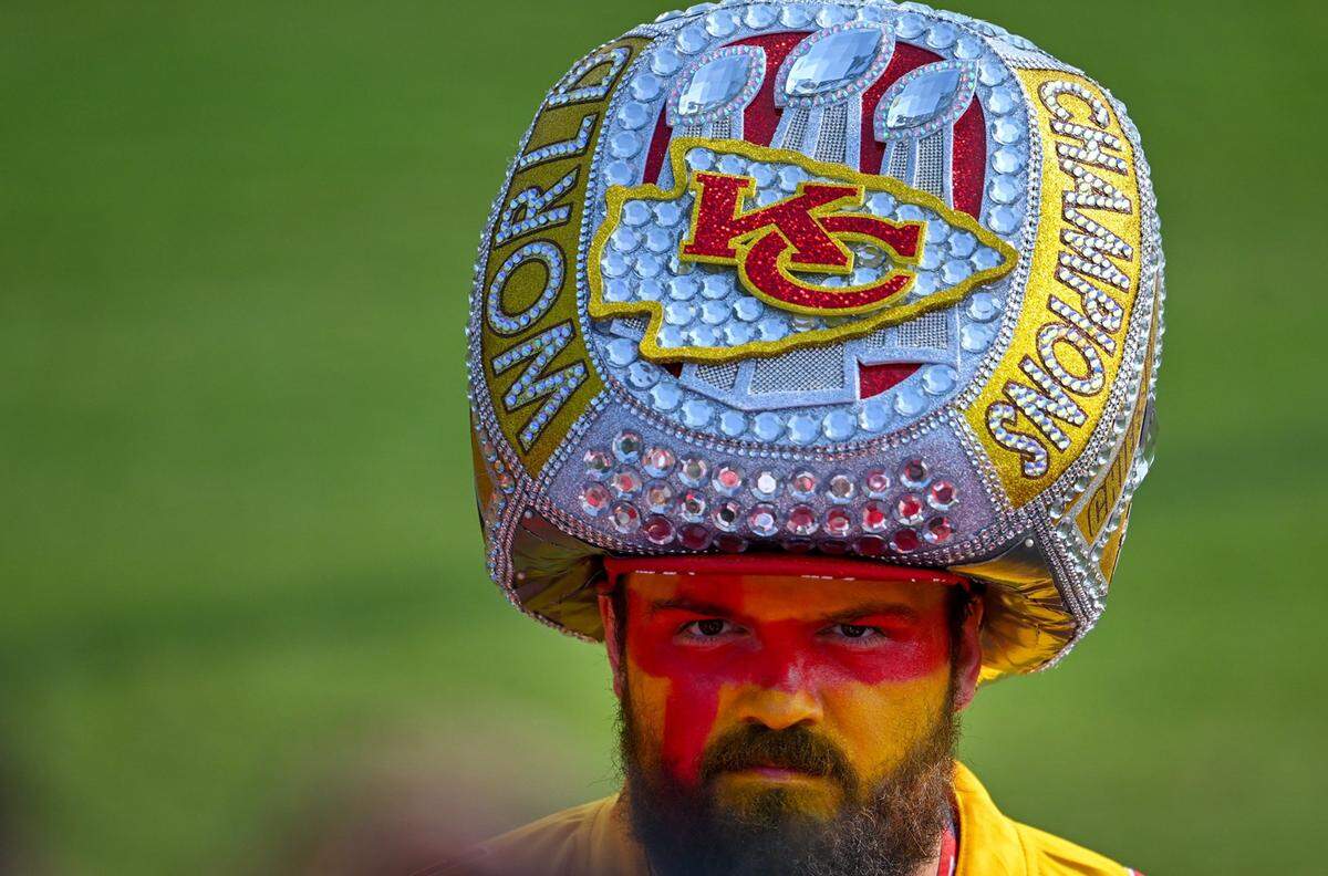 Chiefs fan Taylor Garrison of Springfield, Missouri, donned an oversized Super Bowl ring headpiece during training camp in St. Joseph. Garrison bought the headwear on Etsy for the Kelce Jam concert.