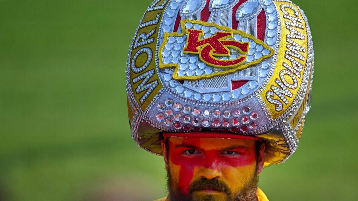 Chiefs fan Taylor Garrison of Springfield, Missouri, donned an oversized Super Bowl ring headpiece during training camp in St. Joseph. Garrison bought the headwear on Etsy for the Kelce Jam concert.