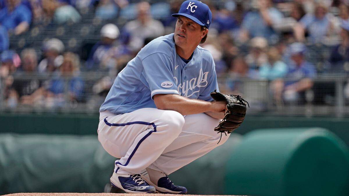 Kansas City Royals starting pitcher Zack Greinke pauses on the mound before the first inning of a baseball game against the Minnesota Twins Thursday, April 21, 2022, in Kansas City, Mo. (AP Photo/Charlie Riedel)