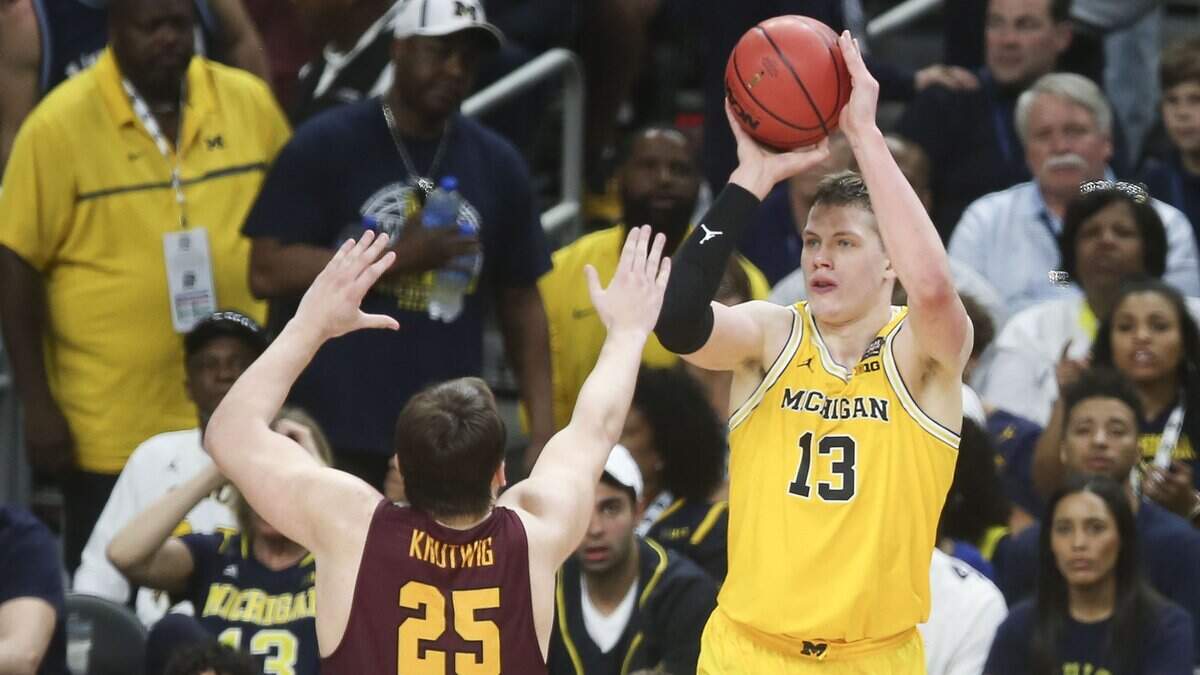 Michigan's Moritz Wagner (right) had a big game against Loyola-Chicago in the NCAA Tournament semifinals on Saturday in San Antonio, scoring 24 points and grabbing 14 rebounds. Wagner and the Wolverines will face Villanova for the title on Monday.