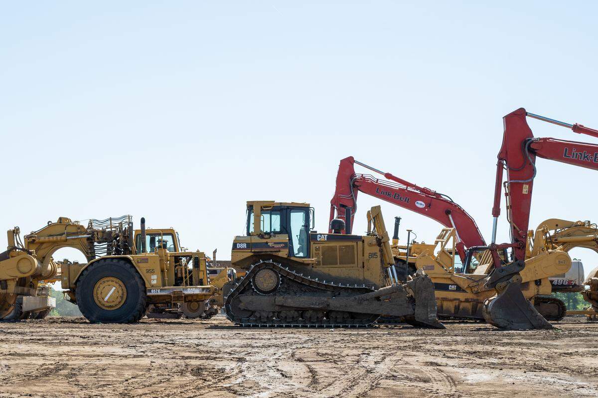 Construction equipment sits idle at the site of a future AI data center being built in Independence, on Tuesday, May 12, 2026.