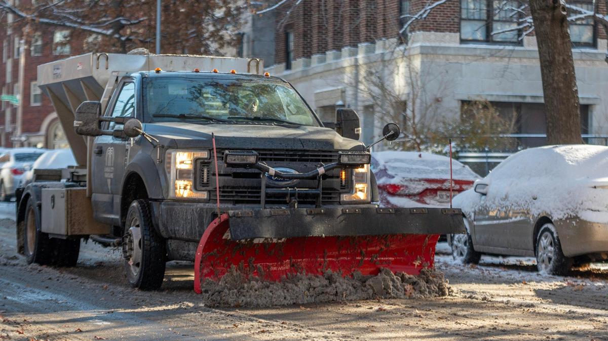 Kansas City Parks and Recreation plows the remaining snow along Armour Boulevard following the city’s first snowfall of the season on Sunday, Nov. 26, 2023.
