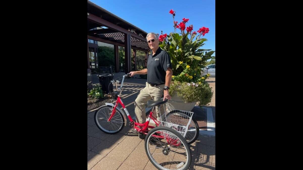 Weight room attendant Stan Pierson checks bikes out to clients
